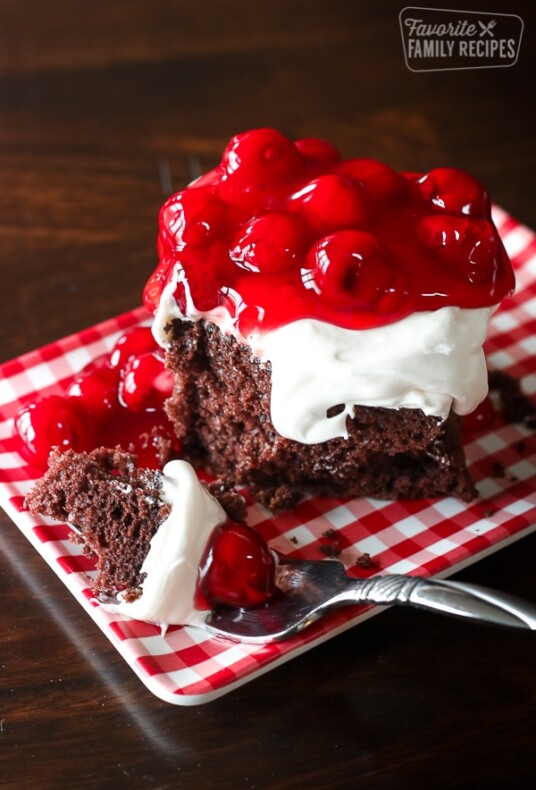 Chocolate Cake with Cherry Topping on a red and white gingham plate
