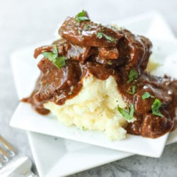 Steak and Gravy on a plate with mashed potatoes