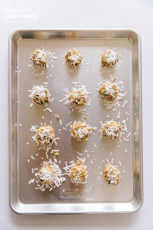 A baking sheet with graham cracker cookies with coconut.