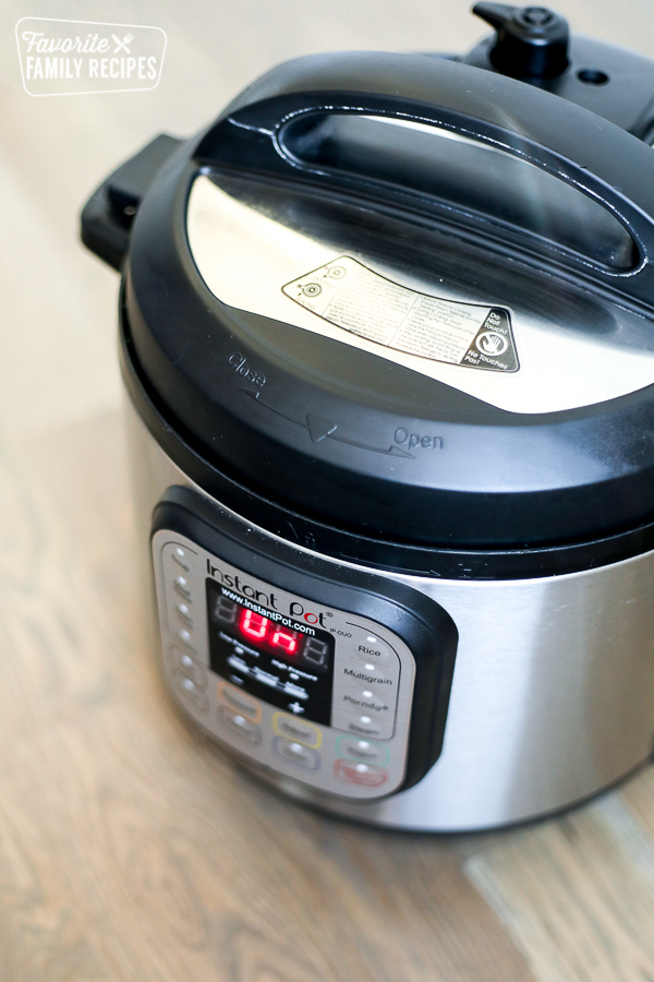 An Instant Pot with the "on" light 