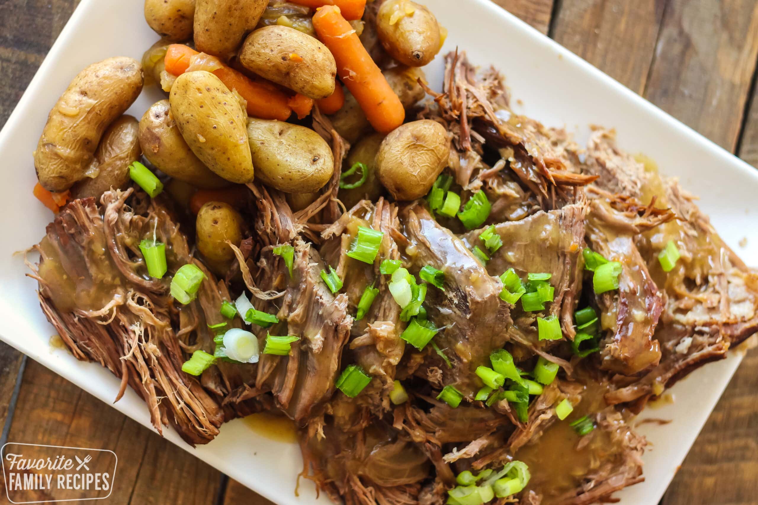 Sunday pot roast with potatoes and carrots on a platter.