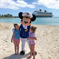 Mickey Mouse on Castaway Cay with two little girls
