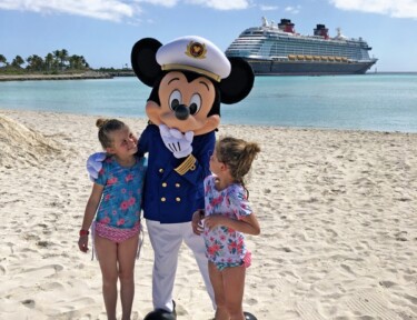 Mickey Mouse on Castaway Cay with two little girls