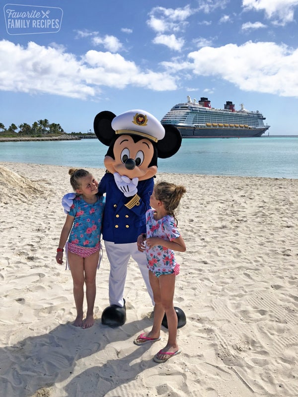 Mickey Mouse on Castaway Cay with two little girls
