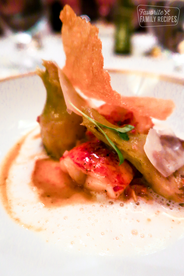 The sixth course. Fresh lobster, served with artichokes, roasted tomato, and a lobster crisp.