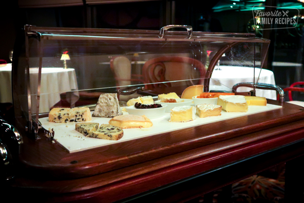 Eighth course. Cheese plate with dried fruit, honeycomb and cherry bread.