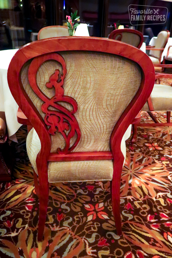 A Remy figure adorning a chair back in the Remy restaurant.