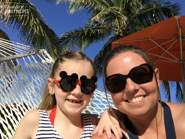 Emily and Piper with sunglasses on at the beach. 