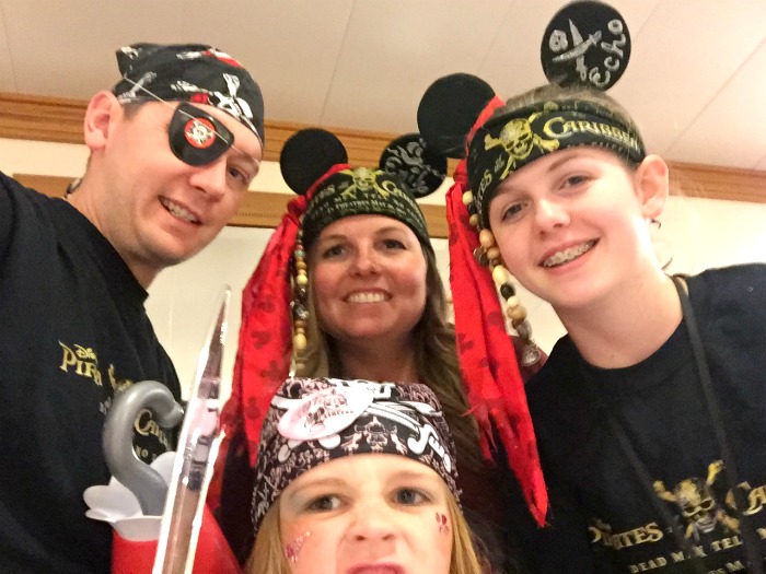Emily and her family dressed in pirate costumes.