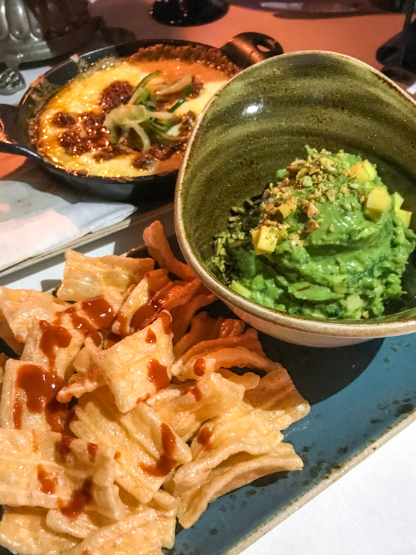 Queso Fundido, Guacamole, and Chicharron and Salsa Valentina served at the San Angel Inn Restaurante inside the Mexico Pavilion at Epcot's World Showcase