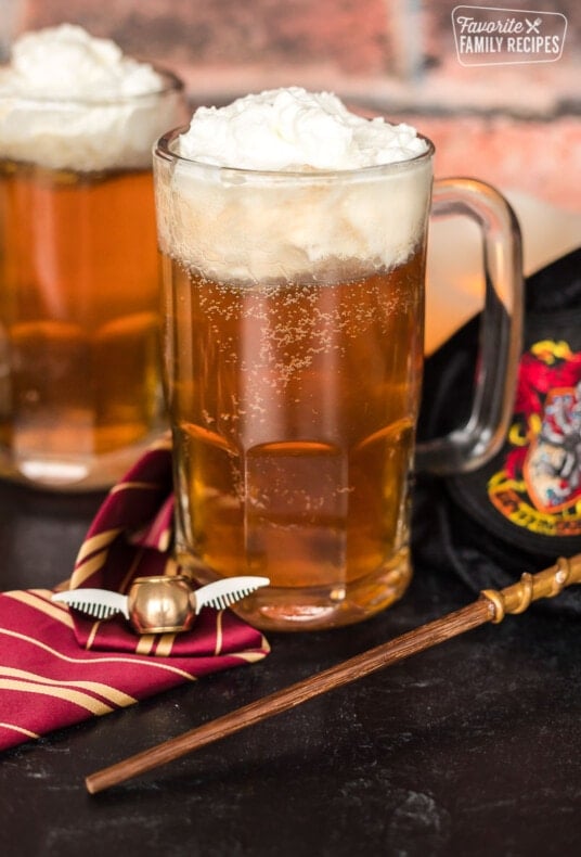 A glass mug of Butterbeer