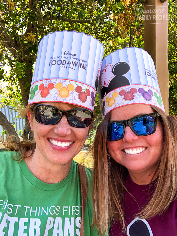 Two women in Disney California Adventure Food & Wine Festival chef hats