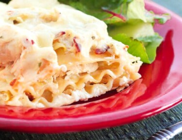 Chicken Bacon and Ranch Lasagna on a plate with salad