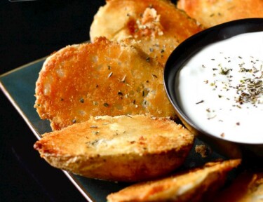 Parmesan Baked Potato Halves with a side of Sour Cream