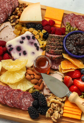 charcuterie board appetizer with meats, cheeses, and vegetables