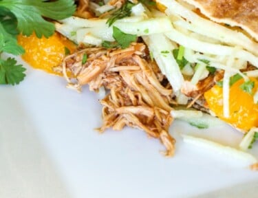 A BBQ Chicken Pita on a white square plate