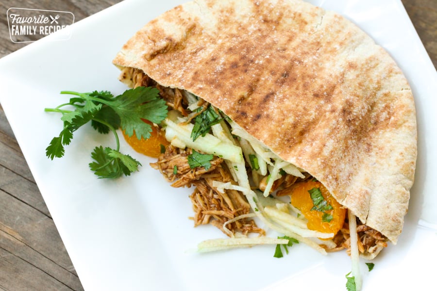 BBQ Chicken Pita with shredded chicken, mandarin oranges, shredded cabbage.