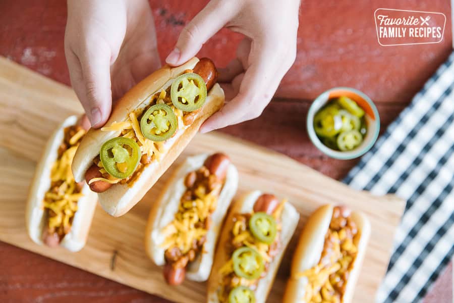 Chili Cheese Dogs are a favorite easy supper to make with the family during warm, summer months. Simple to make, fun to eat, these are a winner!