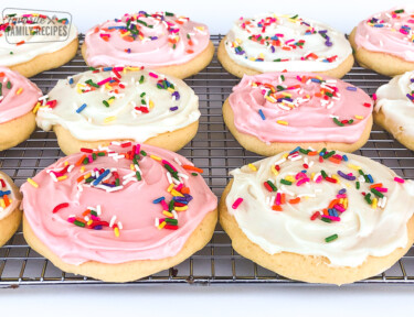 A cooling rack filled with Grandma's Soft Sugar Cookies