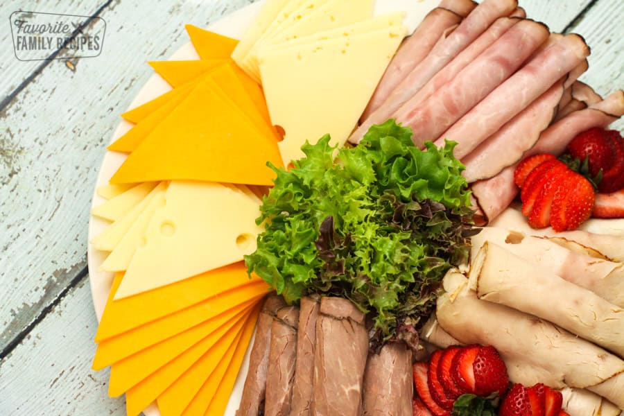 Meat and cheese trays are a great appetizer or an easy way for guests to make their own sandwiches. Perfect for parties, potlucks, BBQs, or family gatherings! Meat and cheese platter