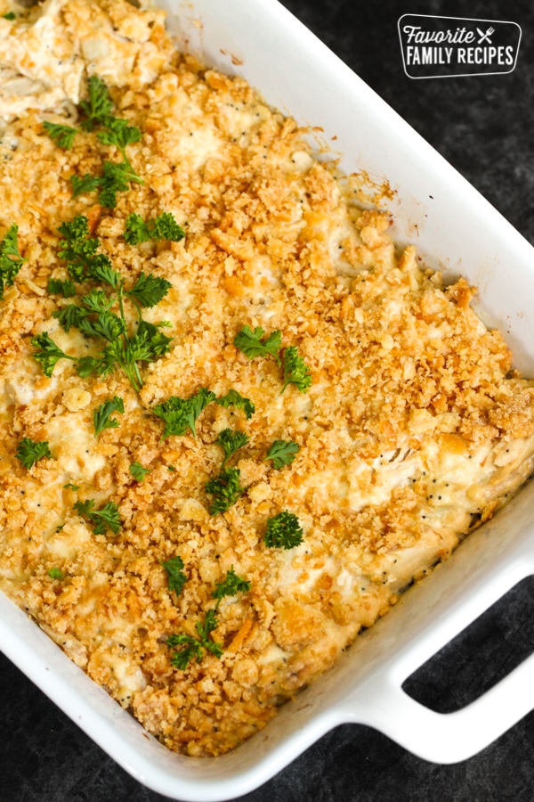 Poppy Seed Casserole in a baking dish garnished with parsley