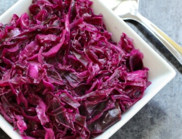 Danish Red Cabbage or Rodkal (Rdkal) served in a white square bowl with a spoon to the side