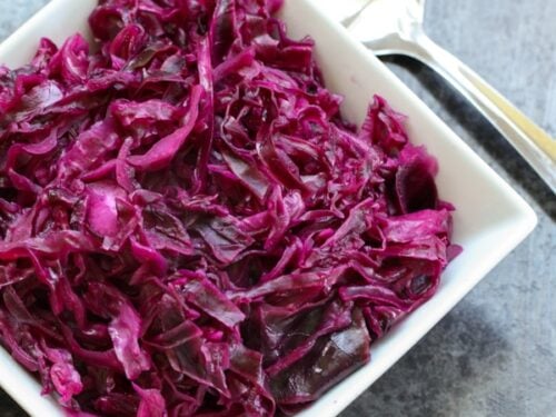 Danish Red Cabbage or Rodkal (Rdkal) served in a white square bowl with a spoon to the side