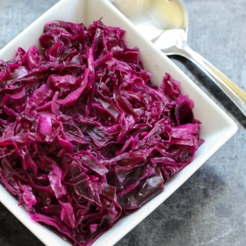 Danish Red Cabbage or Rodkal (Rdkal) served in a white square bowl with a spoon to the side