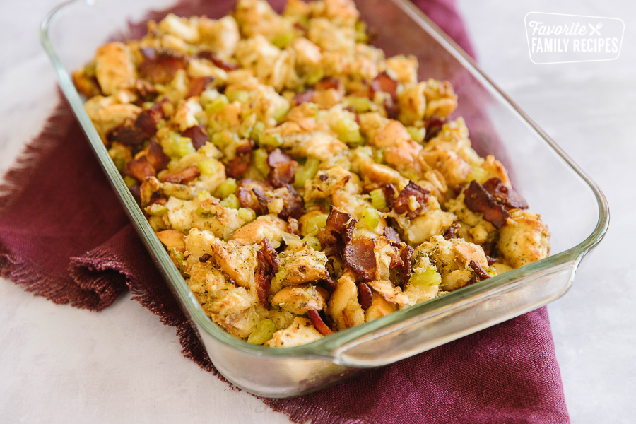 Bacon stuffing in a clear 9x13 pan on a burgundy napkin