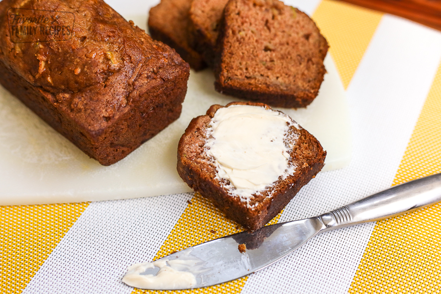 Gluten Free Zucchini Bread sliced with butter spread on it.