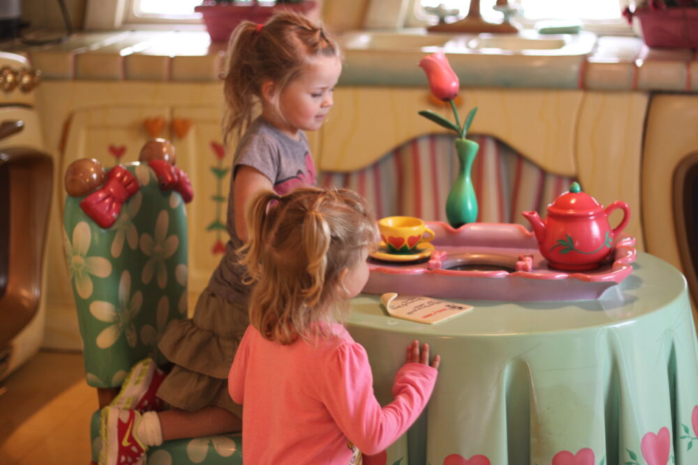 Andie and Gracie in Minnie's house at Disneyland.