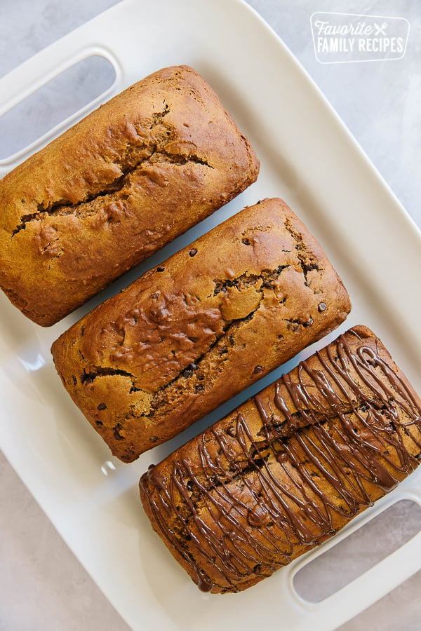 3 loaves of pumpkin bread on a platter