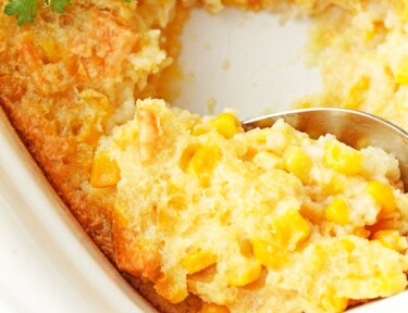 Close up of corn pudding in a glass dish