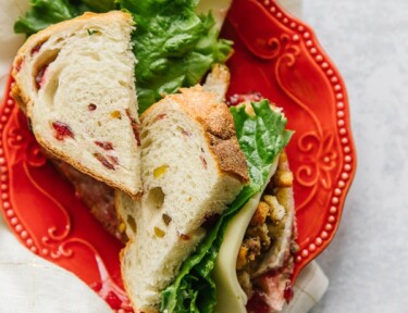 Pilgrim Sandwich cut in half with Cranberry Pistachio Hearth Bread
