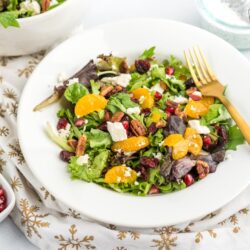 Christmas Salad with Poppyseed Dressing and a bowl of pomegranates