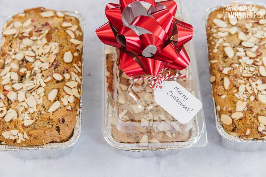 Three loaves of cranberry bread topped with almond slices