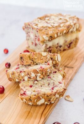 Cranberry bread with slices on a board
