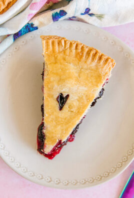 A slice of easy berry pie on a white plate
