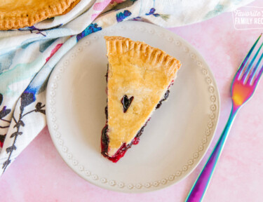 A slice of easy berry pie on a white plate