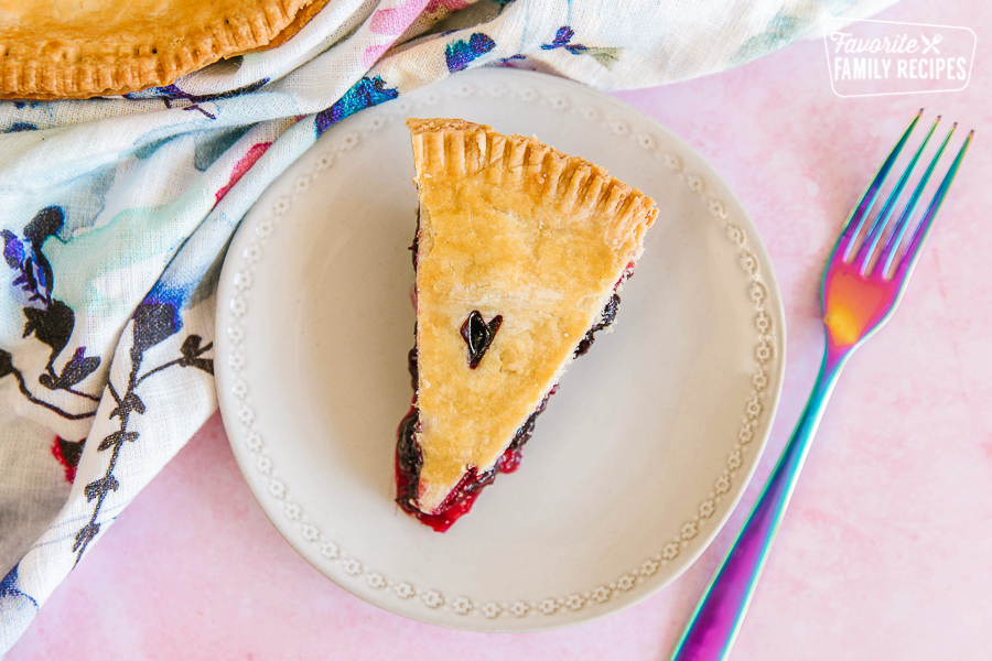 A slice of easy berry pie on a white plate