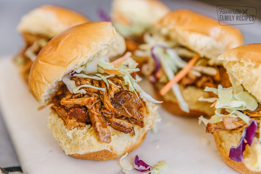 A tray of pulled pork sliders made with pulled pork and coleslaw