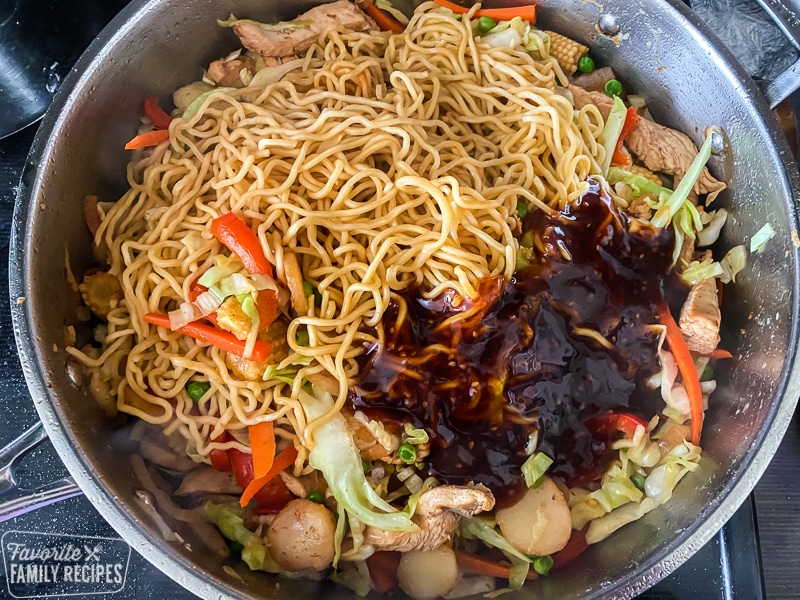 Noodles in a pan with sauce on top