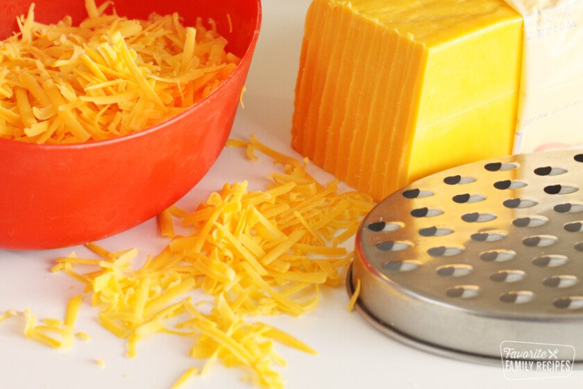 Block of cheddar cheese that has been shredded
