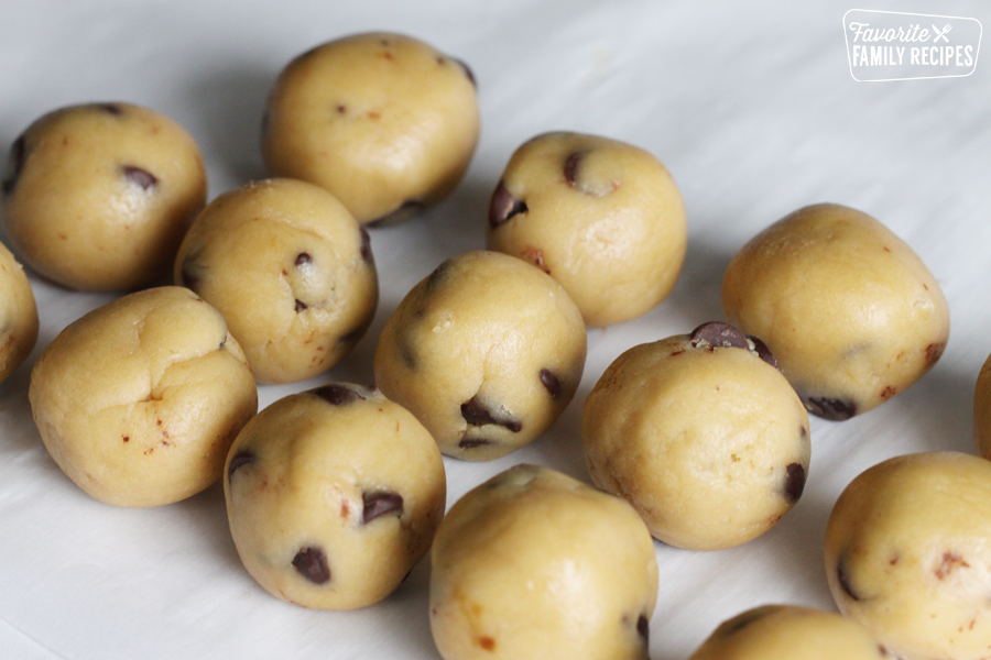 Balls of cookie dough on a tray.