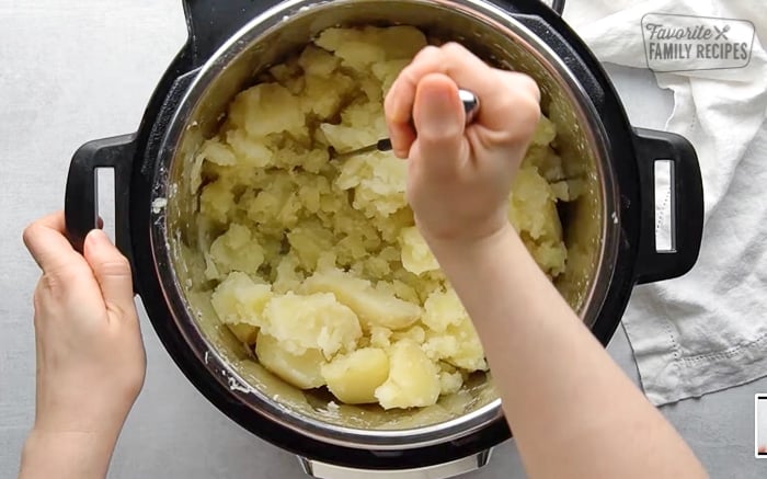 Mashing Instant Pot Potatoes.