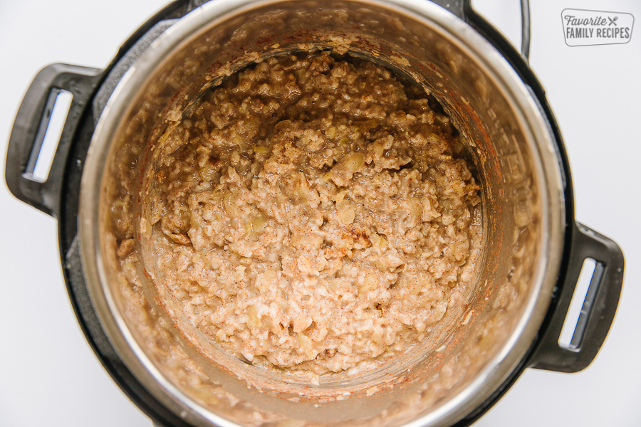 Oatmeal in an instant pot on a white background.