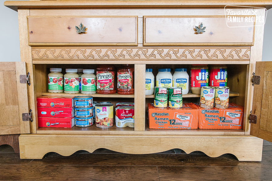 Food stored inside the cabinet doors of a hutch.