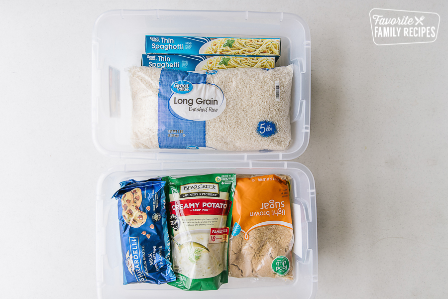 Bags of rice, chocolate chips, soup, and sugar in plastic bins.