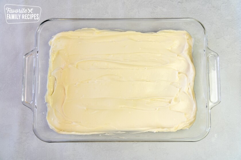 Cream cheese layer on crescent dough for so papilla cheesecake bars.