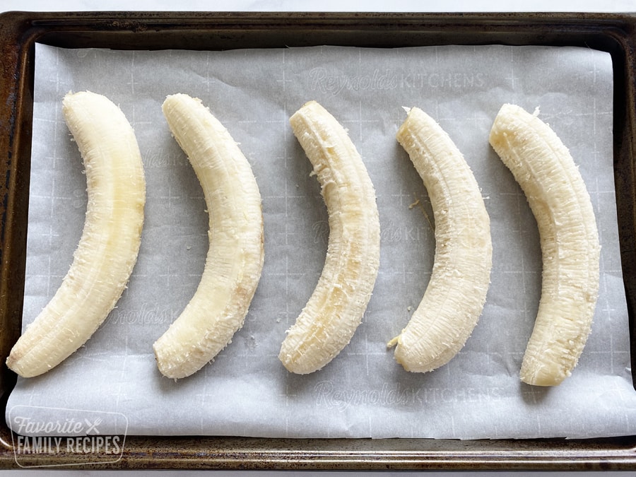 Whole bananas on a baking sheet to freeze.